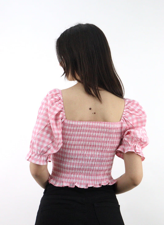Blusa de cuadros y mangas abullonadas, con cordón ajustador