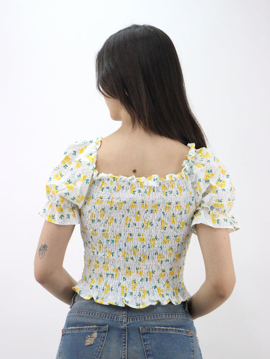 Blusa corta con estampado floral de manga farol con nudo delantero