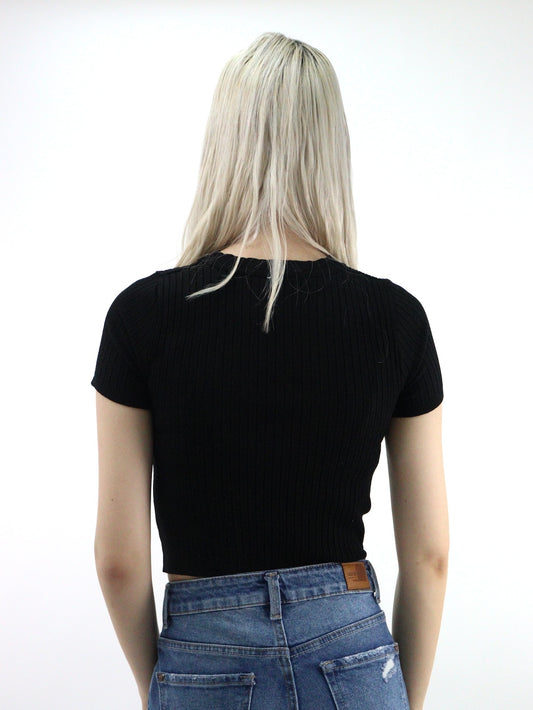 Blusa de punto manga corta color negro con abertura
