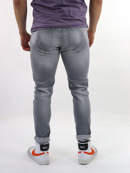 Jeans skinny de color gris con destrucción (NUEVA TEMPORADA)