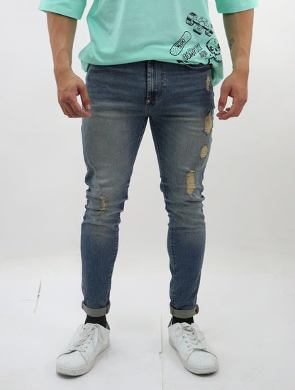 Jeans skinny de color azul deslavado con tinta y destrucción base (NUEVA TEMPORADA)