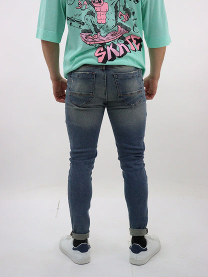 Jeans skinny de color azul deslavado con tinta y destrucción base (NUEVA TEMPORADA)