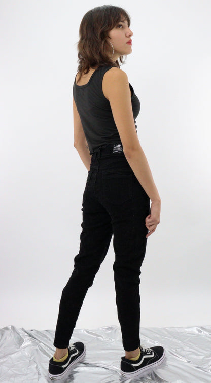 Jeans skinny tiro alto de color negro