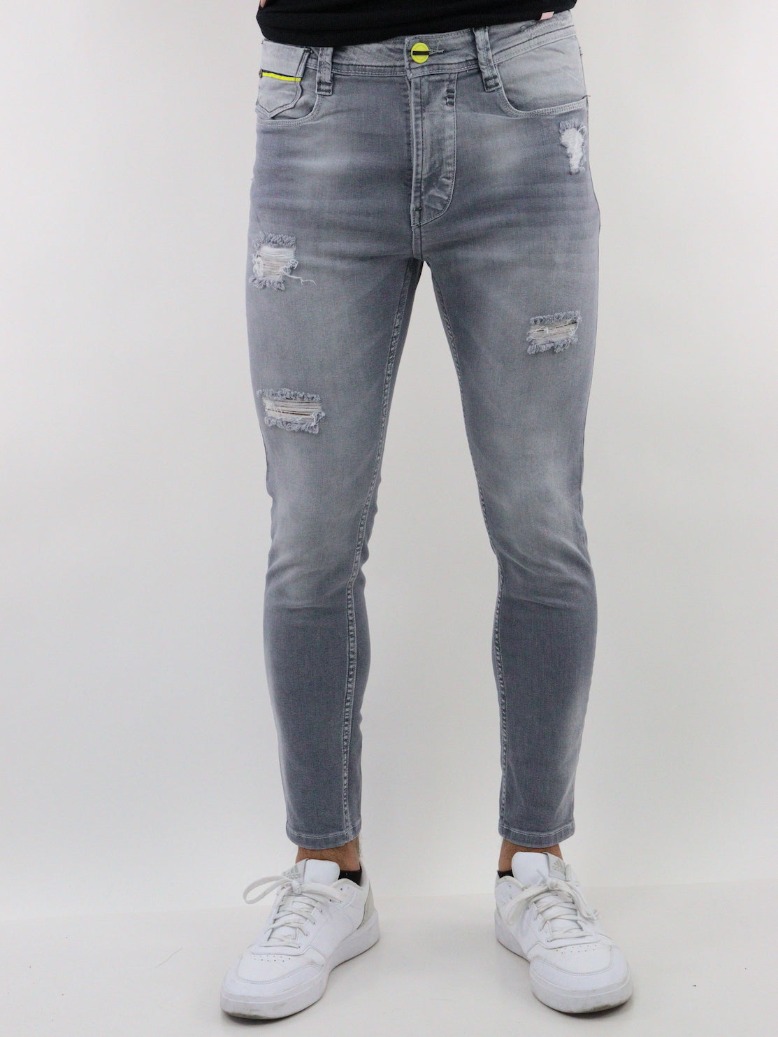 Jeans skinny de color gris con destrucción