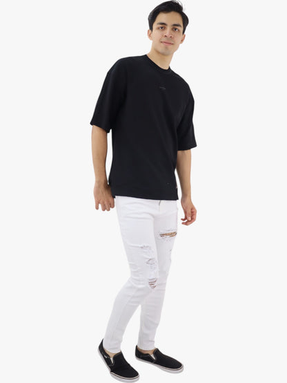 Jeans skinny blanco con destrucción