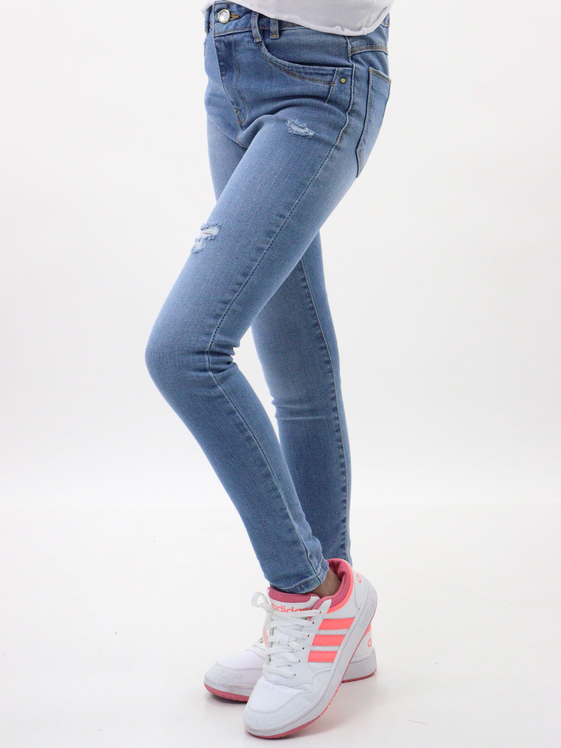 Jeans skinny de color azul medio con destrucción