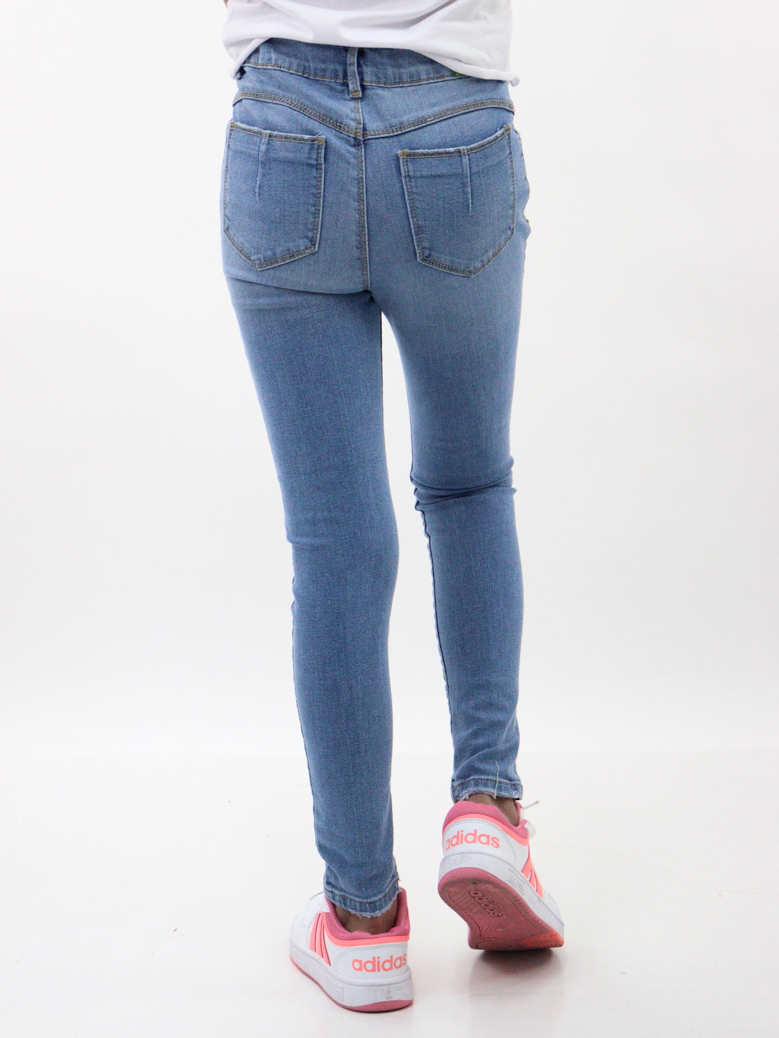 Jeans skinny de color azul medio con destrucción