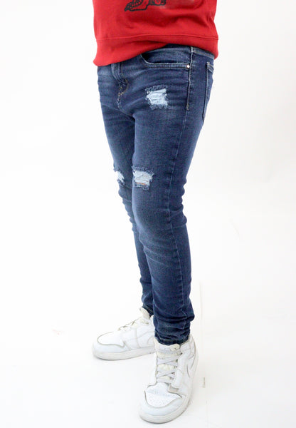 Jeans skinny azul oscuro con destrucción