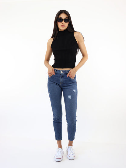 Jeans skinny tiro medio con destrucción